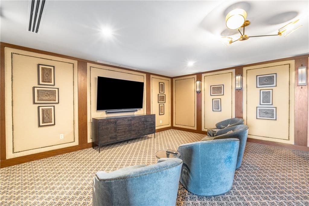 3630 Peachtree Road Northeast, Unit 2404 Atlanta, GA 30326 - Photo 41 of 48 a living room with furniture and a flat screen tv