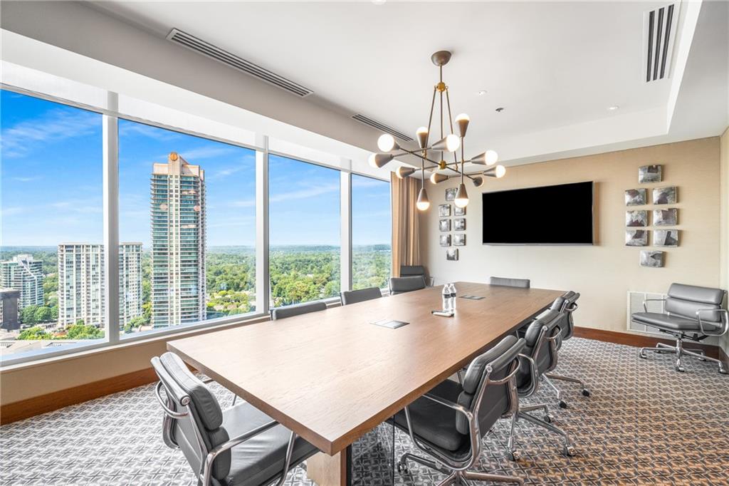 3630 Peachtree Road Northeast, Unit 2404 Atlanta, GA 30326 - Photo 42 of 48 a view of a dining room with furniture window and wooden floor