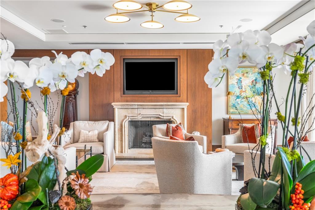 3630 Peachtree Road Northeast, Unit 2404 Atlanta, GA 30326 - Photo 43 of 48 a living room with furniture and a fireplace