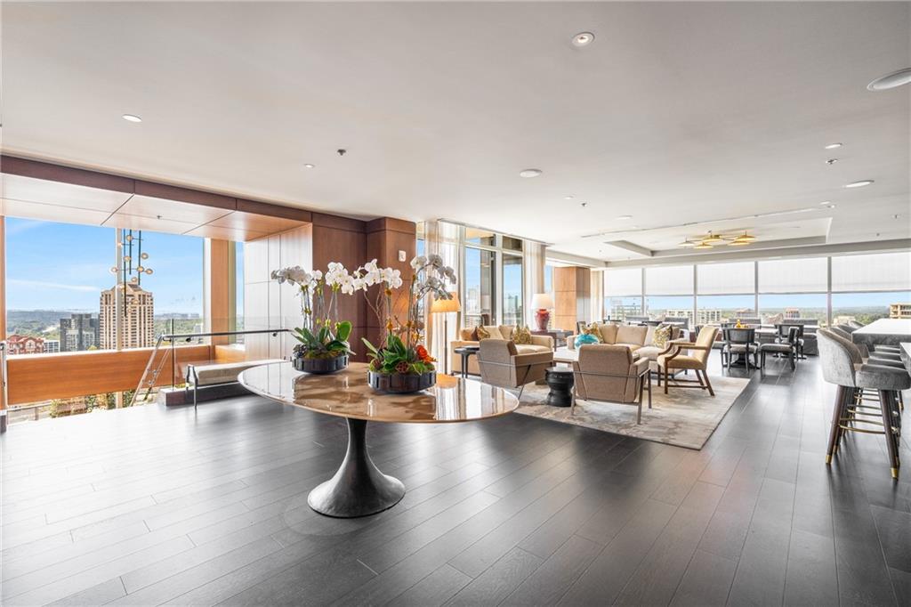 3630 Peachtree Road Northeast, Unit 2404 Atlanta, GA 30326 - Photo 44 of 48 a gym room with lots of furniture and wooden floor