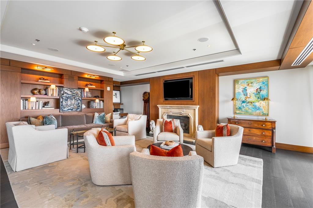 3630 Peachtree Road Northeast, Unit 2404 Atlanta, GA 30326 - Photo 45 of 48 a living room with fireplace furniture and a large window