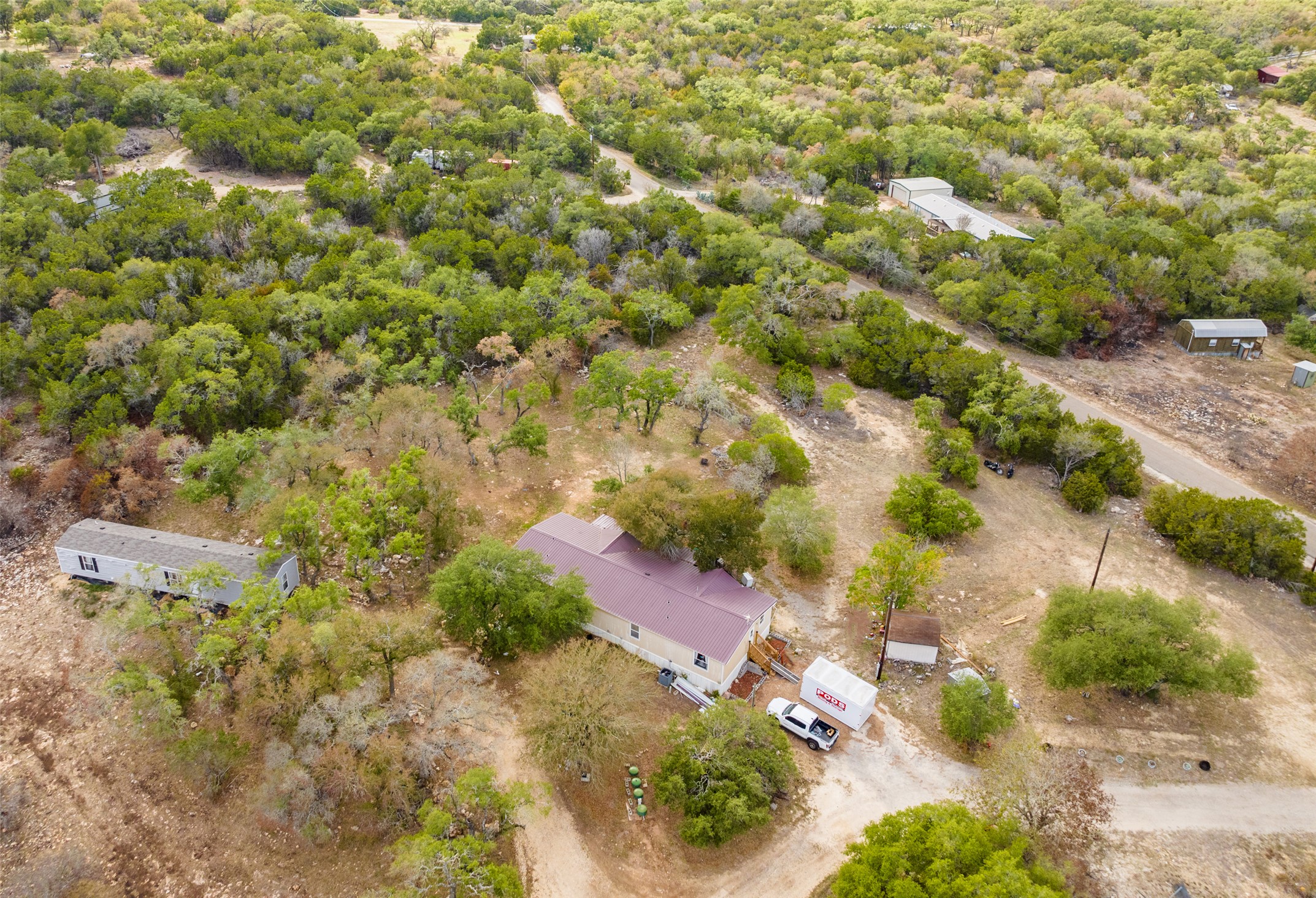 an aerial view of residential houses with outdoor space