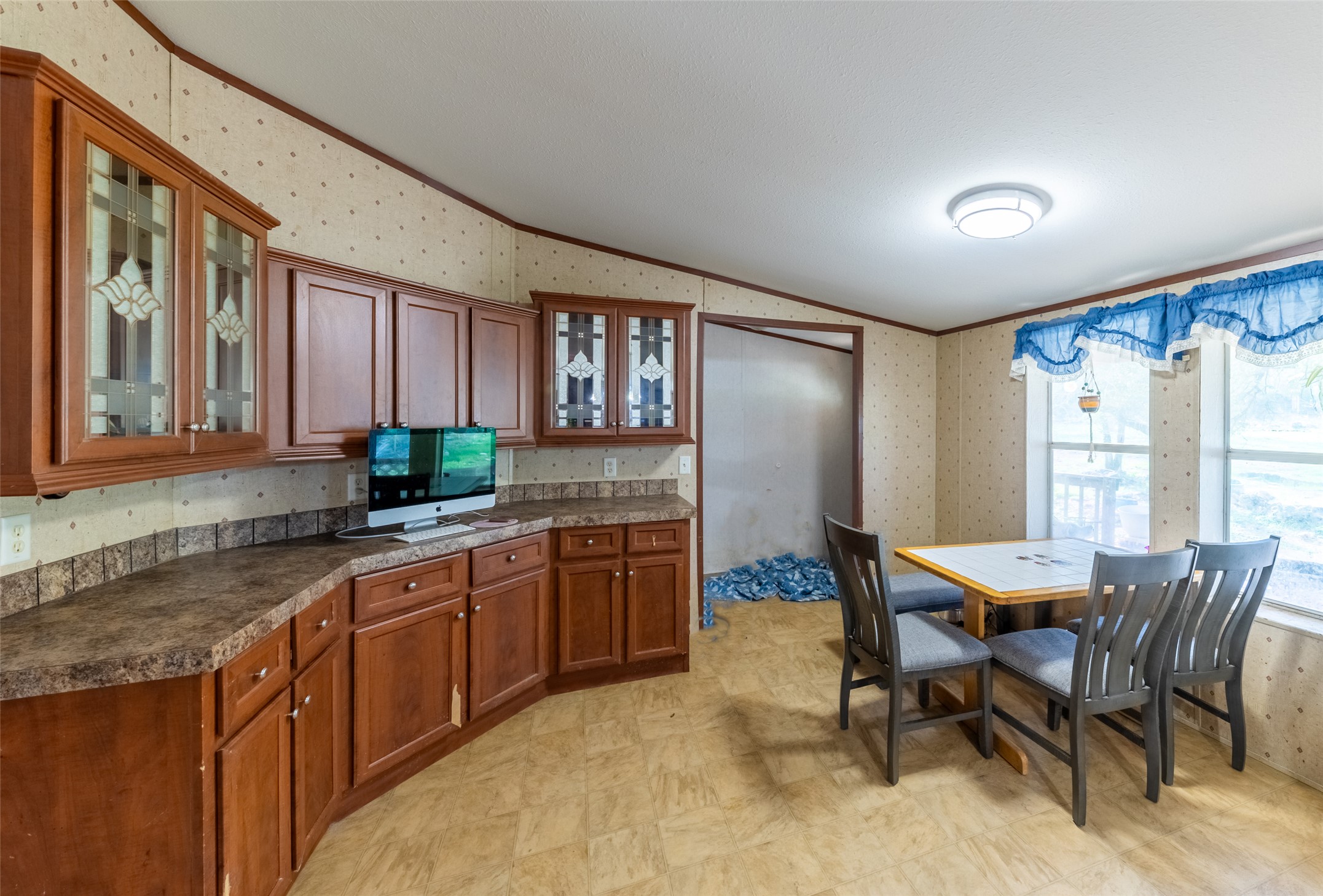 212 Fox Road San Marcos, TX 78666 - Photo 10 of 18 a kitchen with granite countertop lots of counter top space and dining table