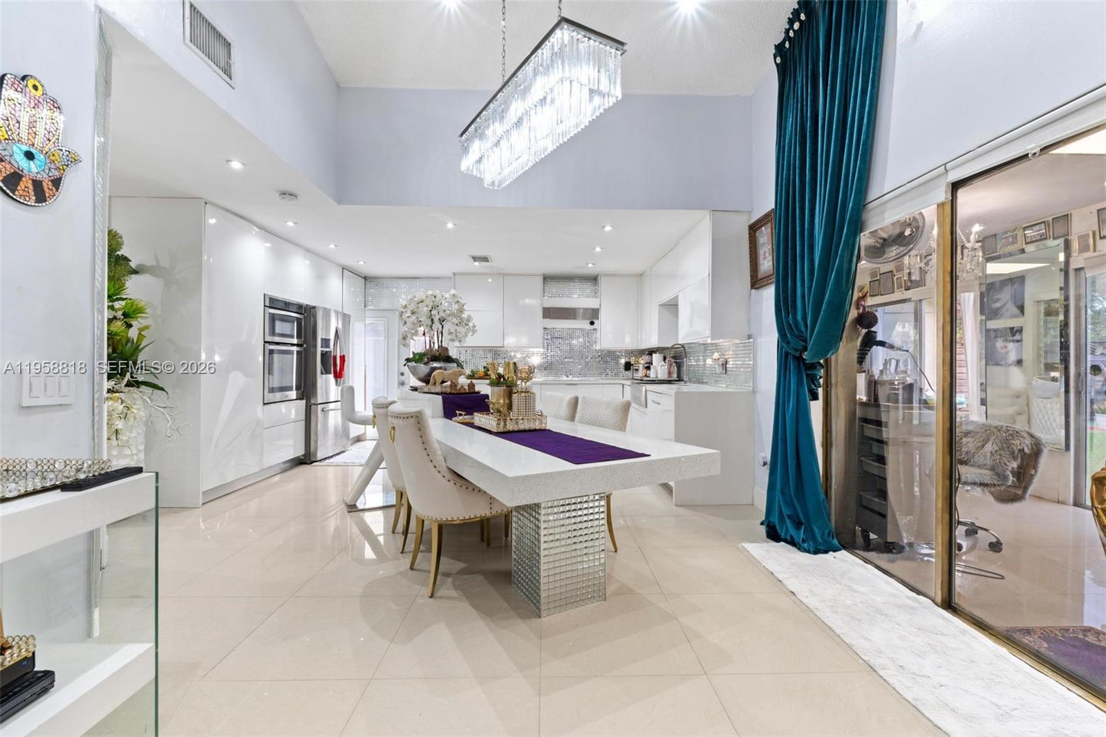 5018 Southwest 148th Place Miami, FL 33185 - Photo 4 of 14 a room with stainless steel appliances kitchen island granite countertop furniture and a kitchen view