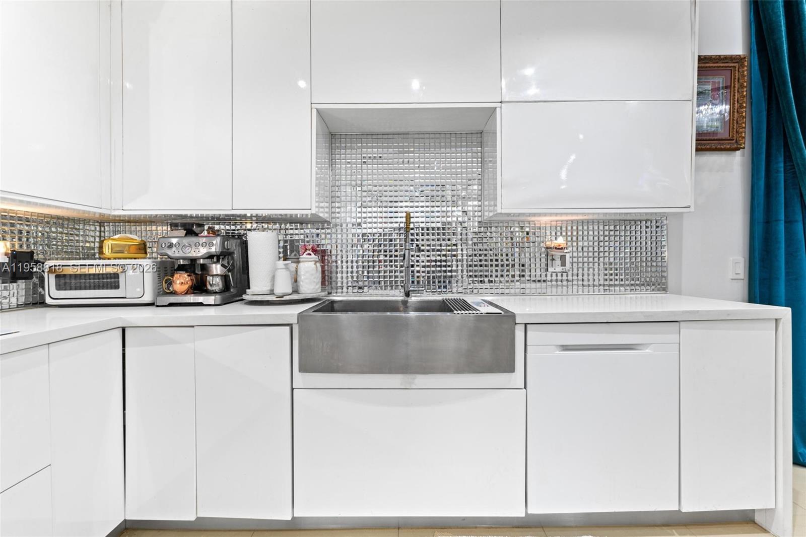 5018 Southwest 148th Place Miami, FL 33185 - Photo 5 of 14 a kitchen with granite countertop a sink and a stove