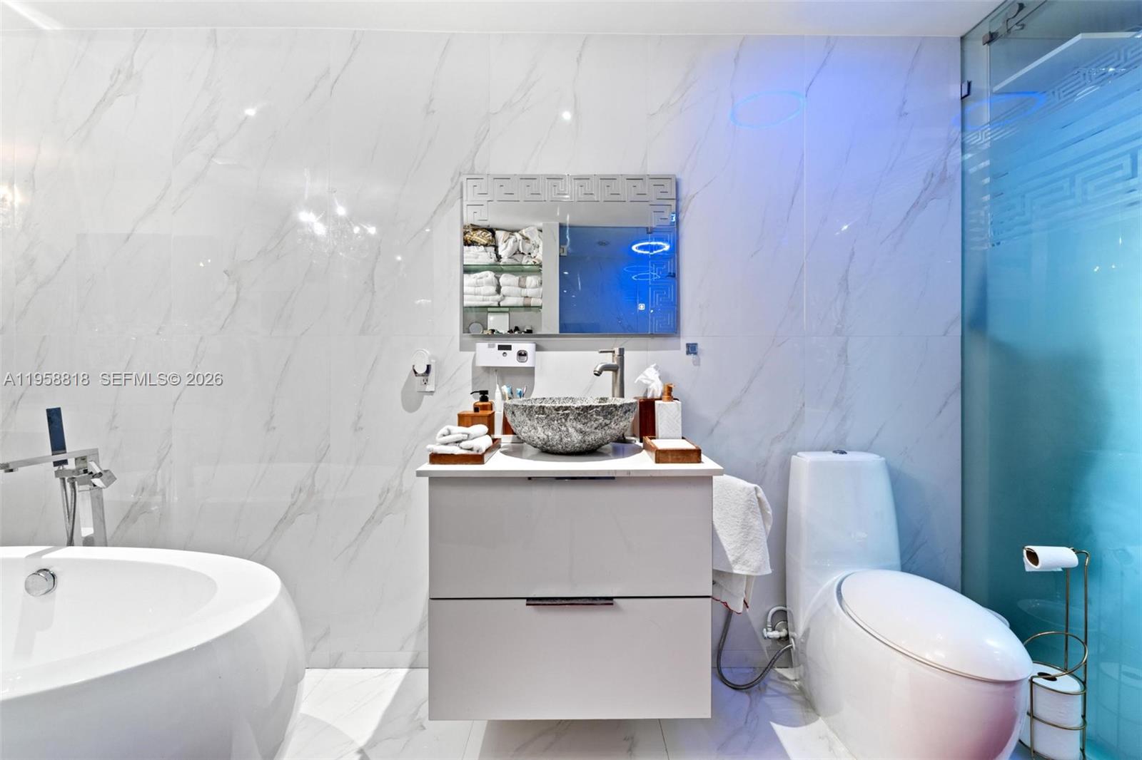 5018 Southwest 148th Place Miami, FL 33185 - Photo 8 of 14 a bathroom with a sink toilet and shower