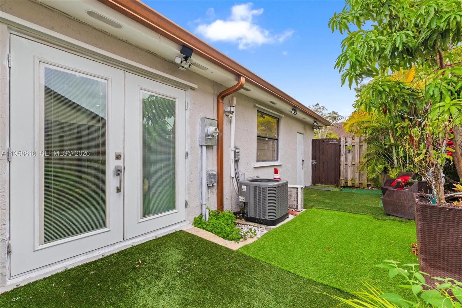 5018 Southwest 148th Place Miami, FL 33185 - Photo 10 of 14 a backyard of a house with seating space