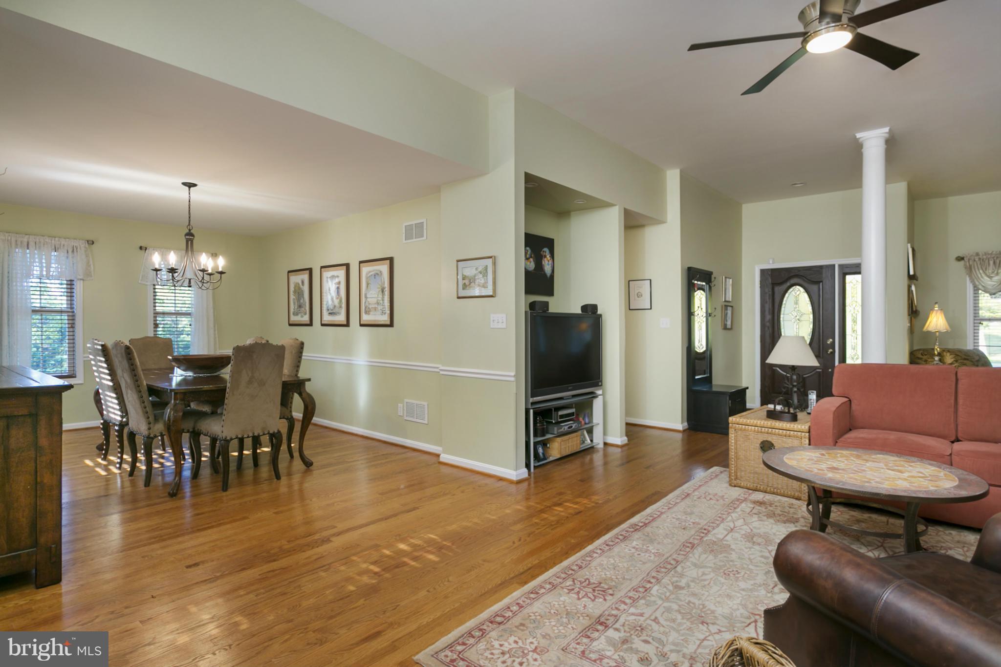 14921 Harrisville Road Mount Airy, MD 21771 - Photo 11 of 28 a living room with furniture a dining table and with kitchen appliances