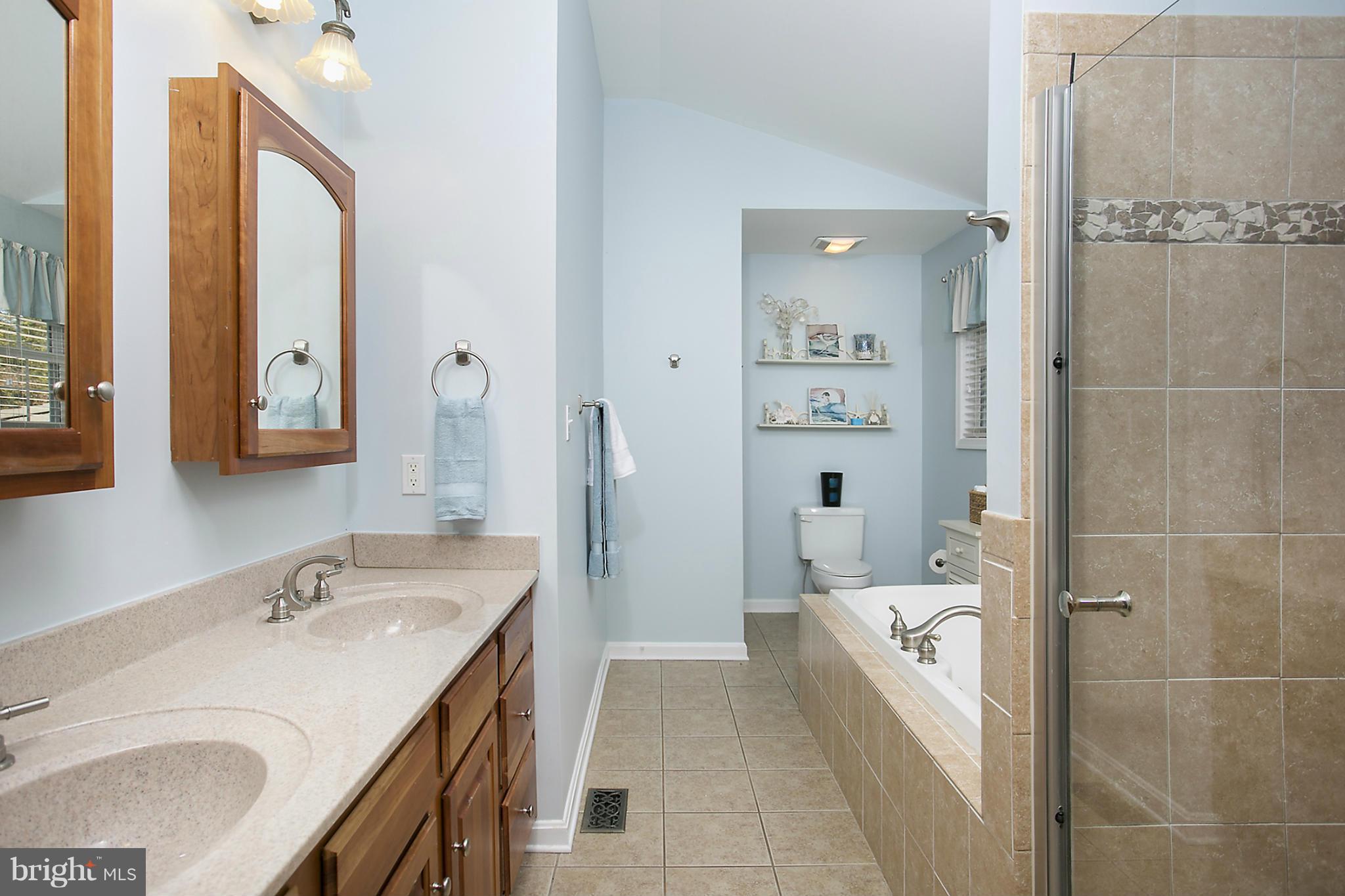 14921 Harrisville Road Mount Airy, MD 21771 - Photo 17 of 28 a bathroom with a granite countertop sink a mirror and a bathtub