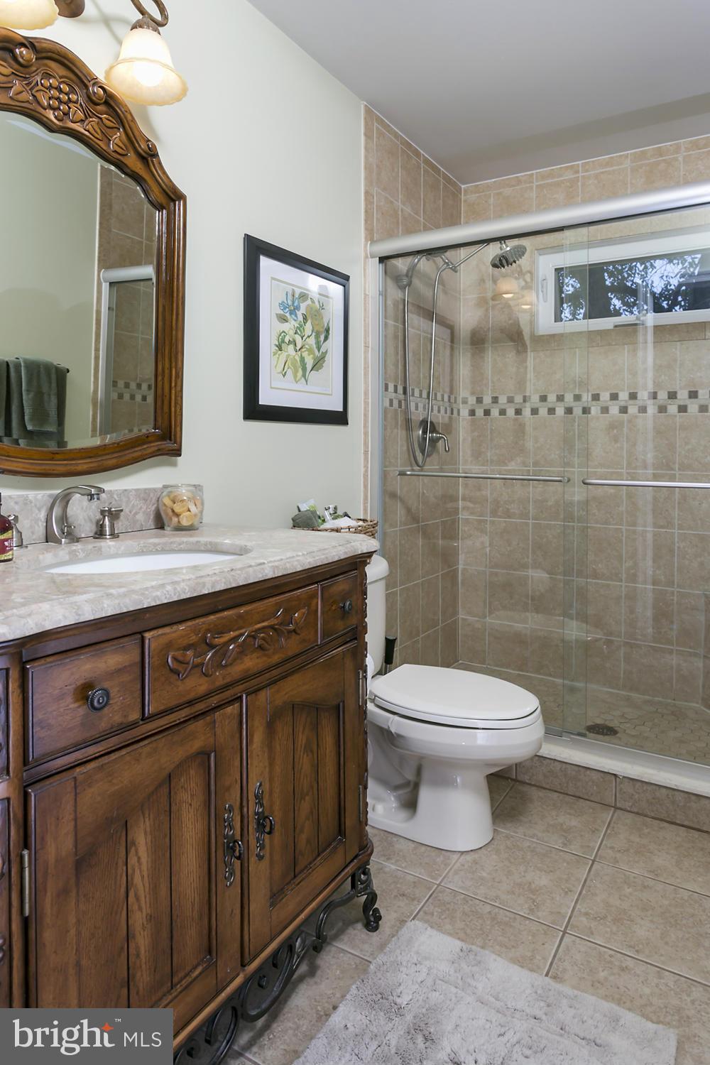 14921 Harrisville Road Mount Airy, MD 21771 - Photo 24 of 28 a bathroom with a sink a toilet and shower