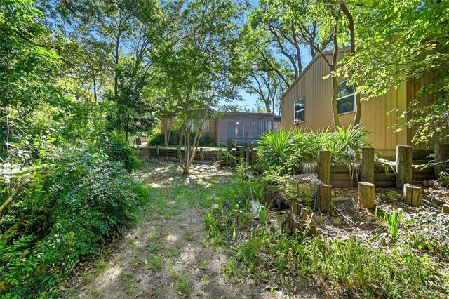 a backyard of a house with lots of green space