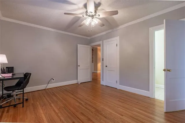 a view of room with hardwood floor and workspace