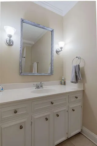 a bathroom with a sink vanity and mirror