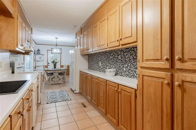 a kitchen with stainless steel appliances granite countertop a sink and cabinets
