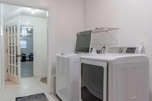 a utility room with dryer and washer