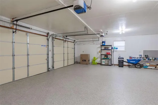 a view of a garage with furniture and a garage