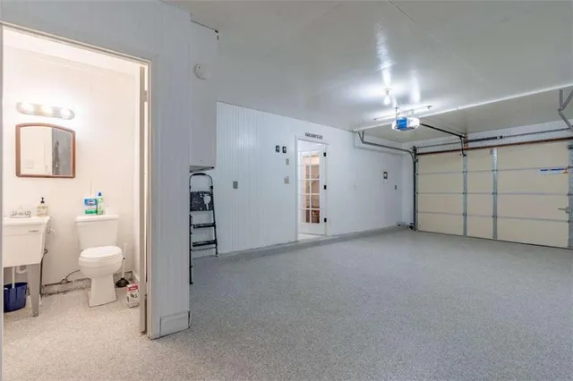 a view of a room with a furniture and chandelier fan