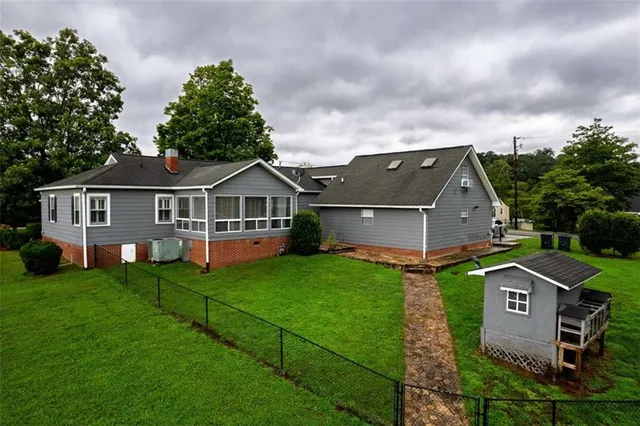 a aerial view of a house with a yard