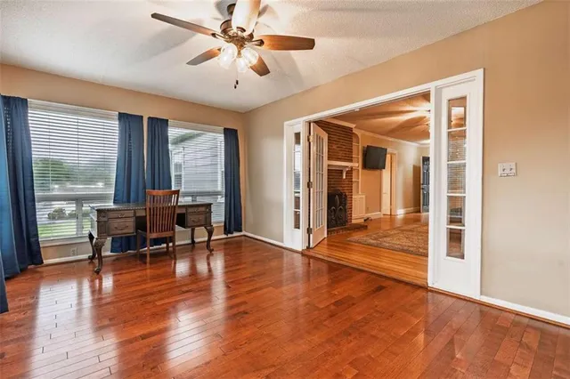 a view of a livingroom with furniture window and wooden floor