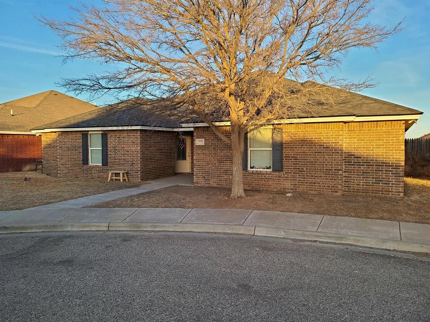 304 North Clinton Avenue, Unit A Lubbock, TX 79416 - Photo 1 of 24 front view of a house with a street