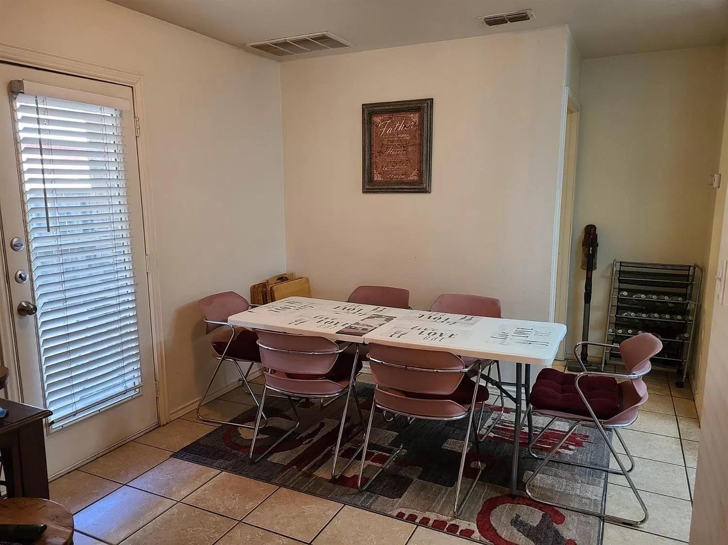 304 North Clinton Avenue, Unit A Lubbock, TX 79416 - Photo 5 of 24 a dining room with furniture and wooden floor