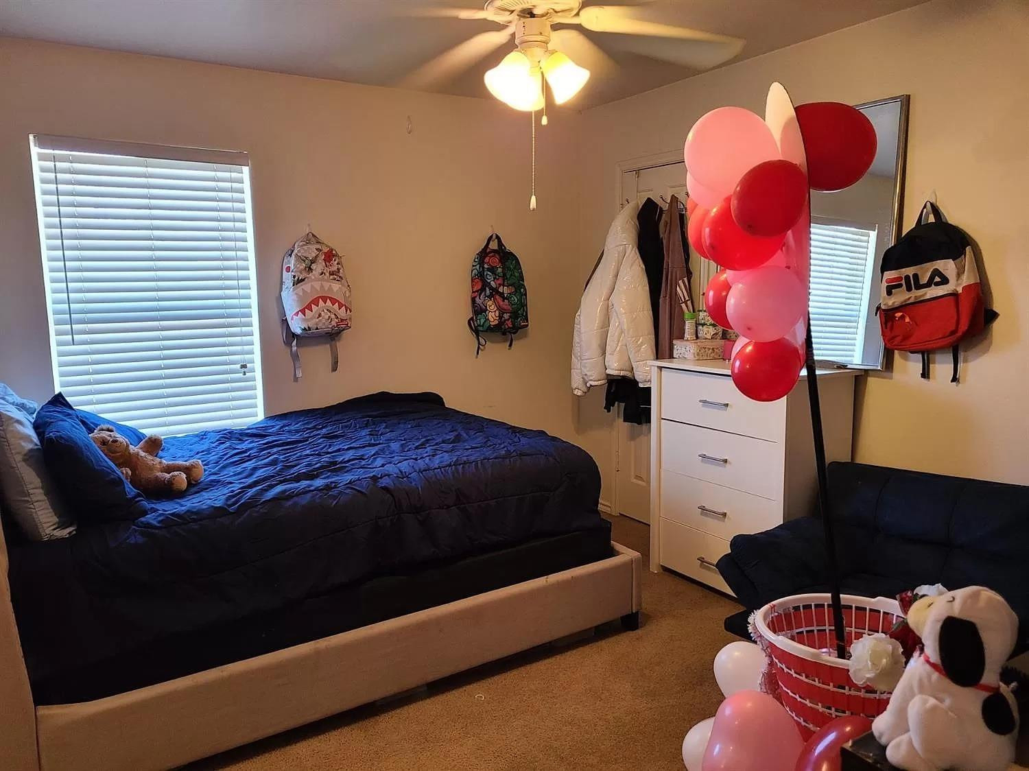 304 North Clinton Avenue, Unit A Lubbock, TX 79416 - Photo 6 of 24 a bedroom with a bed and window