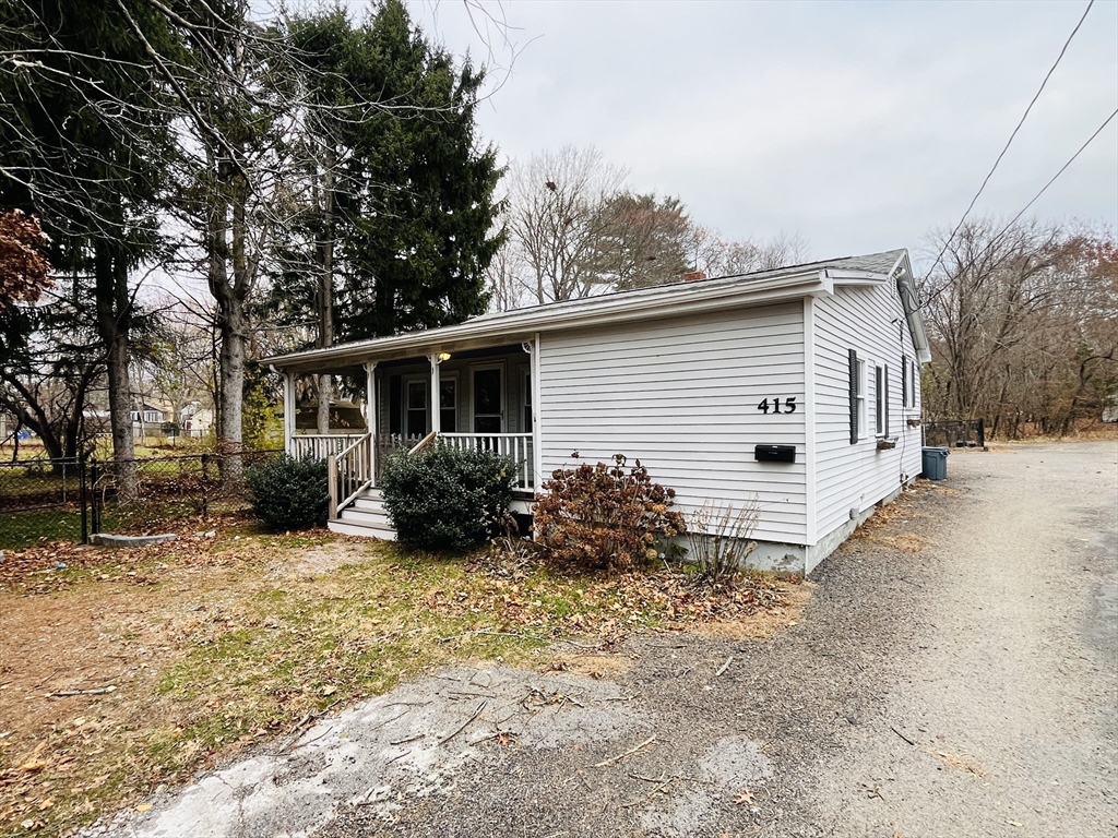 415 Pearl Street Stoughton, MA 02072 - Photo 1 of 24 a view of a house with backyard and sitting area