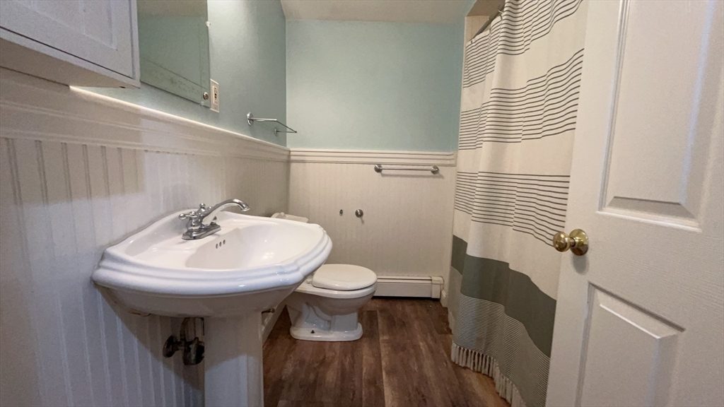 415 Pearl Street Stoughton, MA 02072 - Photo 16 of 24 a bathroom with a sink toilet and a mirror
