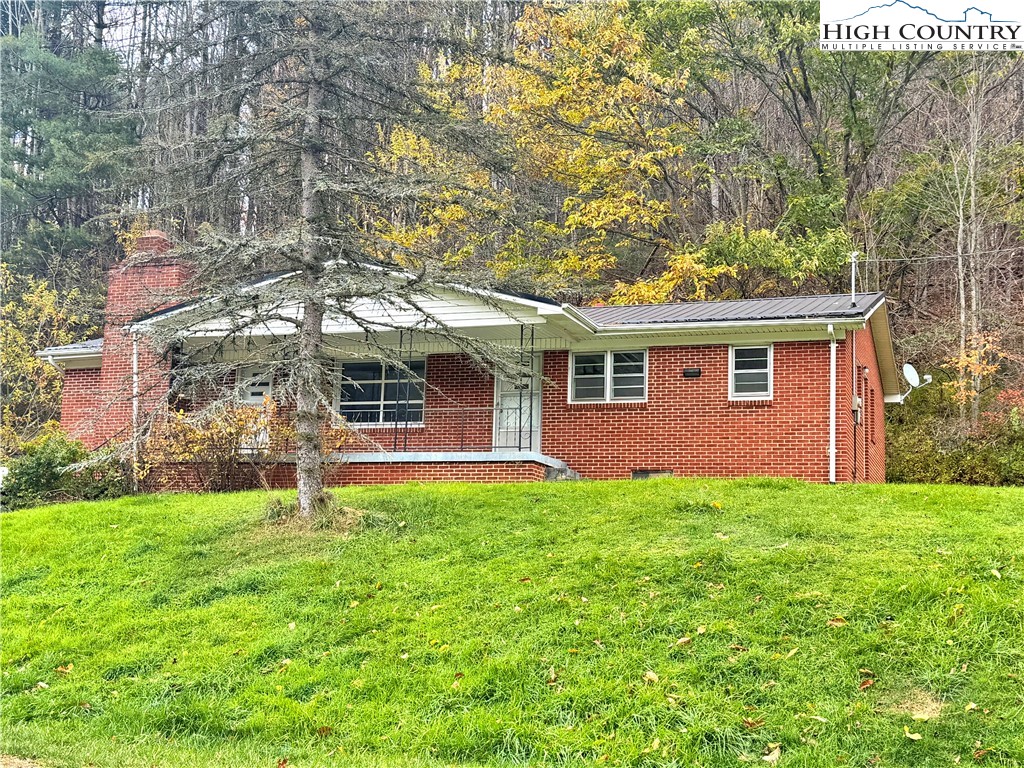 2510 Rich Hill Road Creston, NC 28615 - Photo 2 of 29 a front view of a house with a yard