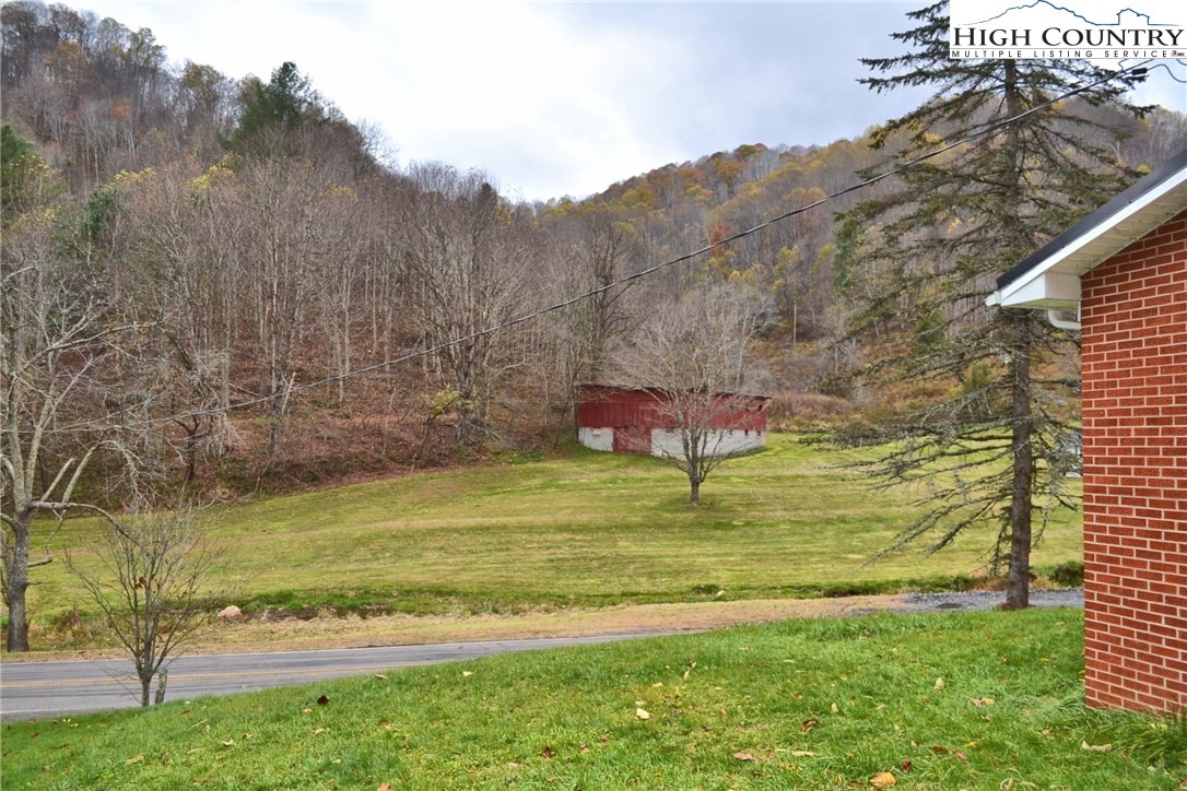 2510 Rich Hill Road Creston, NC 28615 - Photo 28 of 29 a swimming pool with wooden fence