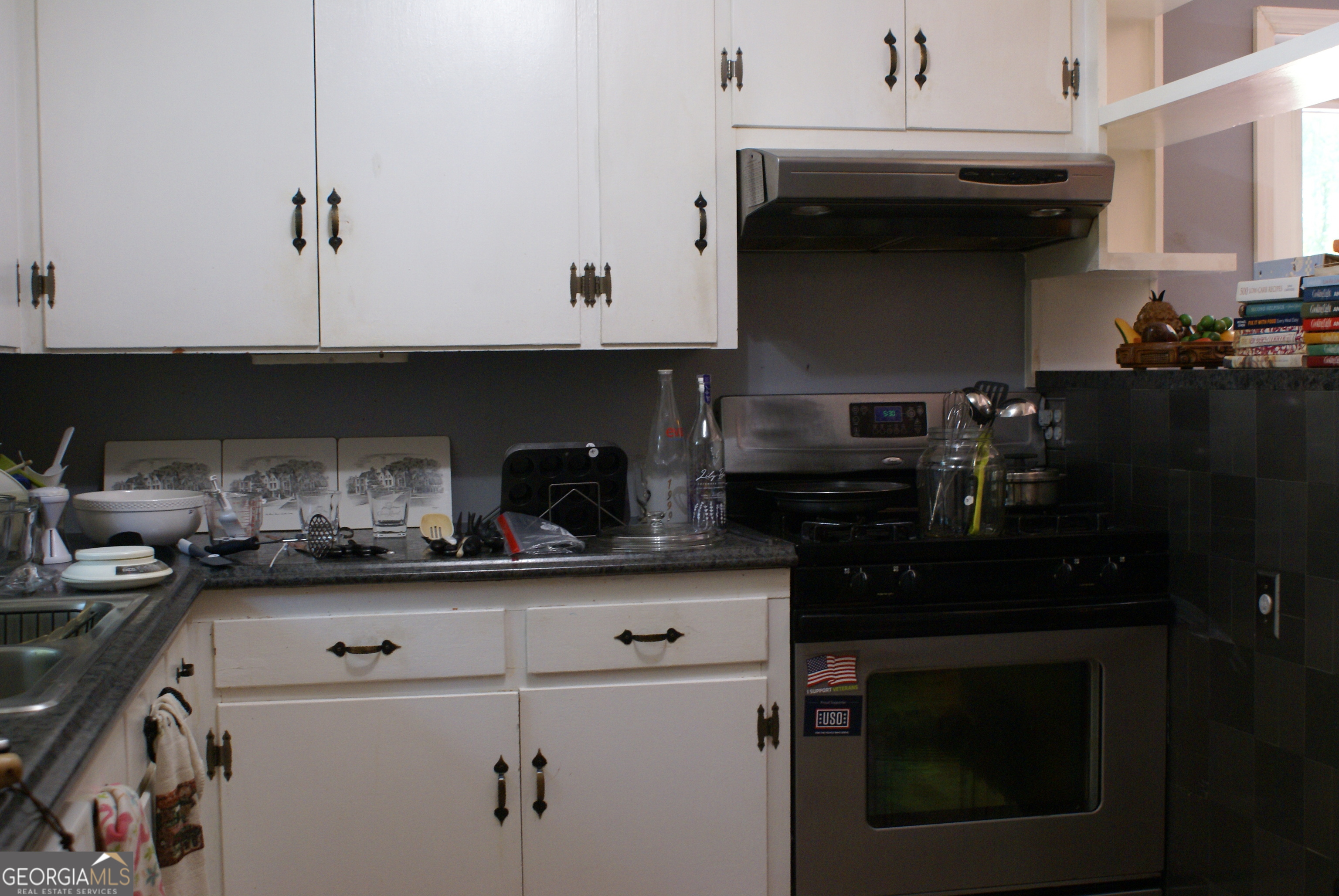 1591 Waymanville Road Thomaston, GA 30286 - Photo 9 of 24 a kitchen with a sink and cabinets