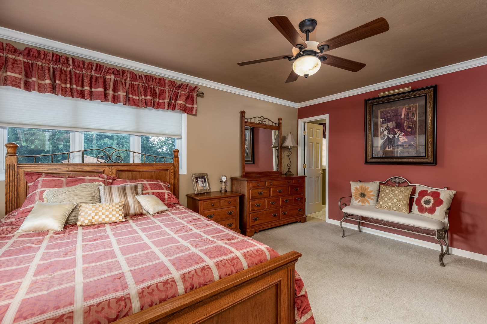 1407 Sharon Road Streator, IL 61364 - Photo 20 of 32 a bedroom with a large bed and a chandelier