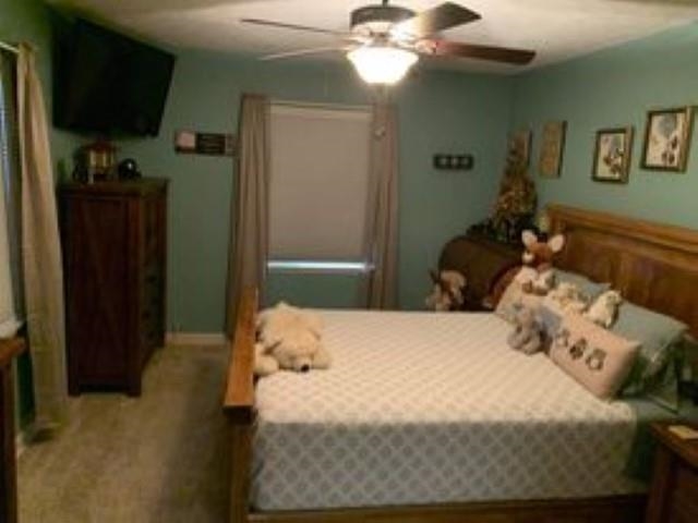 2186 South Riverside Drive Beloit, WI 53511 - Photo 13 of 24 a bedroom with a bed and a chandelier
