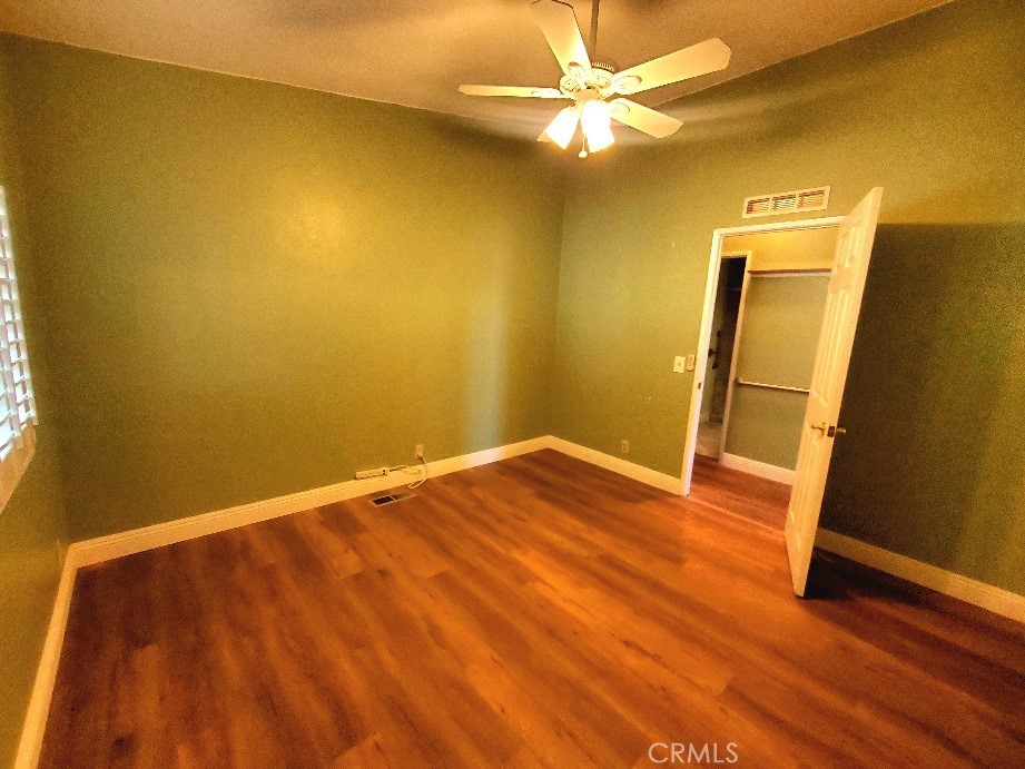 12550 Main Street, Unit 31 Hesperia, CA 92345 - Photo 23 of 50 a view of a room with wooden floor and fan