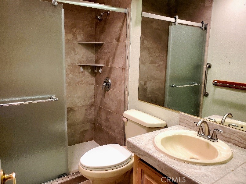 12550 Main Street, Unit 31 Hesperia, CA 92345 - Photo 25 of 50 a bathroom with a toilet a sink and shower