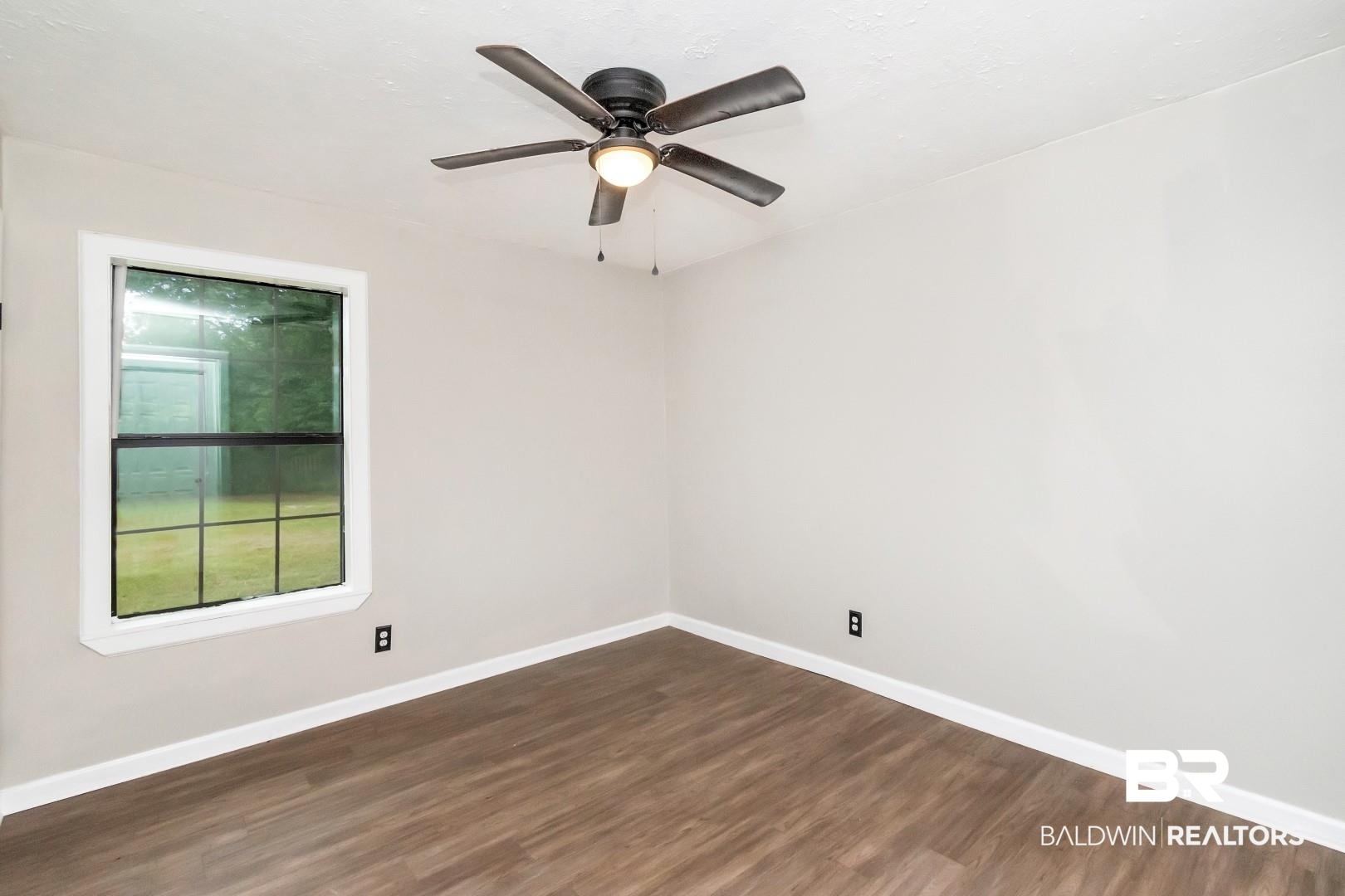 15060 Starlight Avenue Wilmer, AL 36587 - Photo 6 of 12 Spare room with hardwood / wood-style flooring and ceiling fan