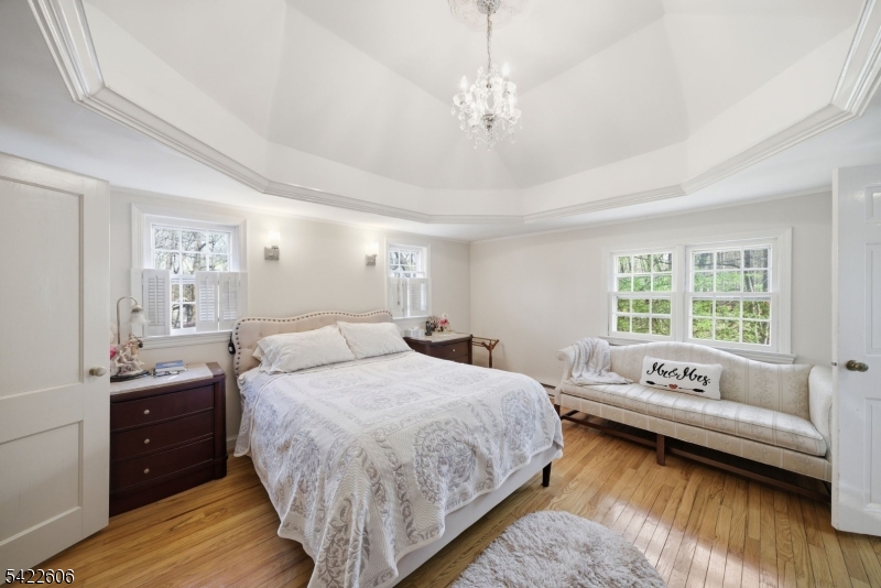 399 Springbrook Trail Sparta, NJ 07871 - Photo 8 of 27 a spacious bedroom with a bed and a couch
