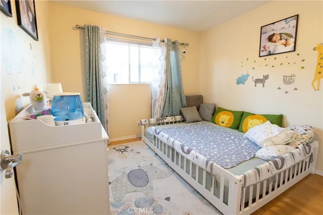 a bedroom with a bed and a table