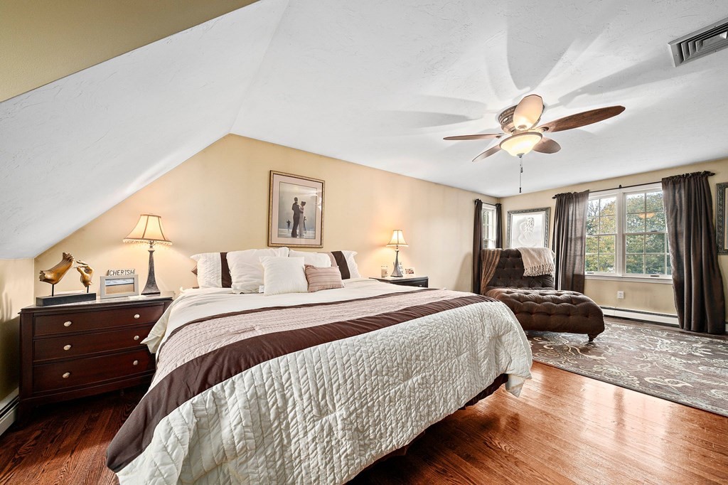 20 Spring Valley Road Hull, MA 02045 - Photo 16 of 30 a bedroom with a bed and a large window with wooden floor