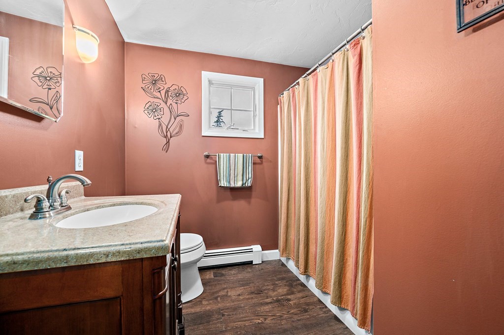 20 Spring Valley Road Hull, MA 02045 - Photo 18 of 30 a bathroom with a granite countertop sink and a mirror