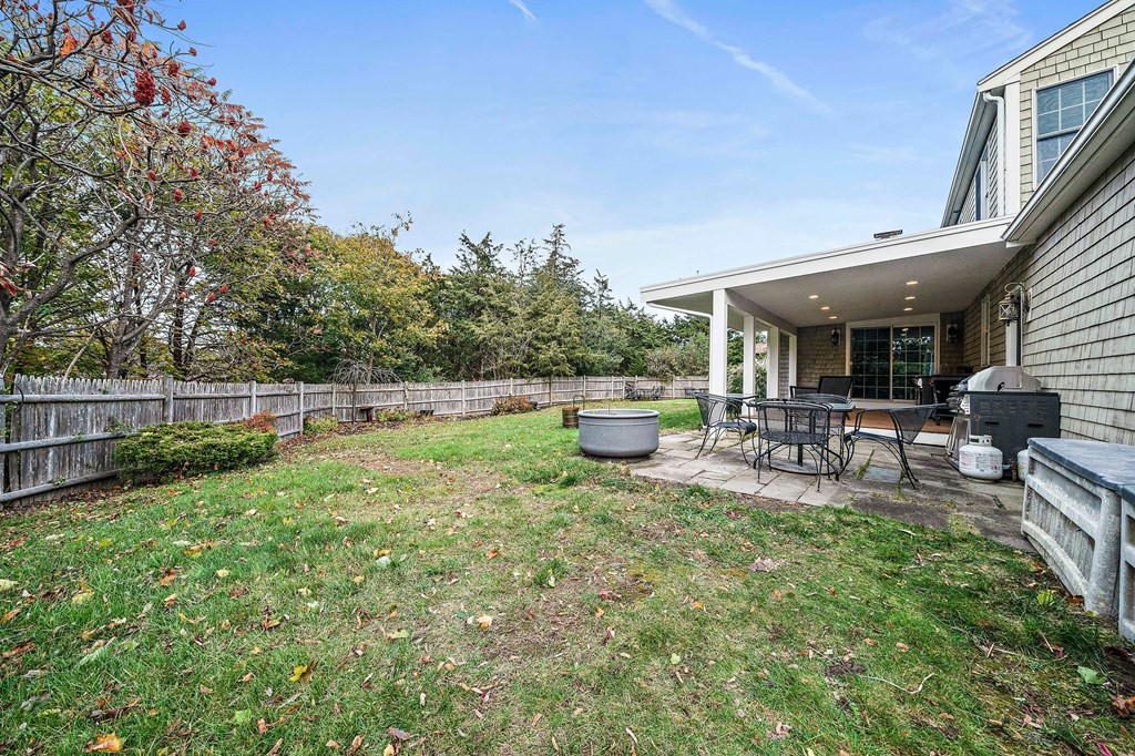 20 Spring Valley Road Hull, MA 02045 - Photo 21 of 30 a view of a chair and table in backyard of the house