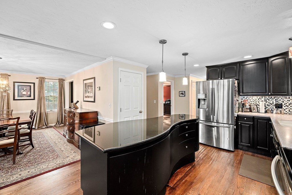 20 Spring Valley Road Hull, MA 02045 - Photo 5 of 30 a kitchen with stainless steel appliances granite countertop a refrigerator a sink and a stove