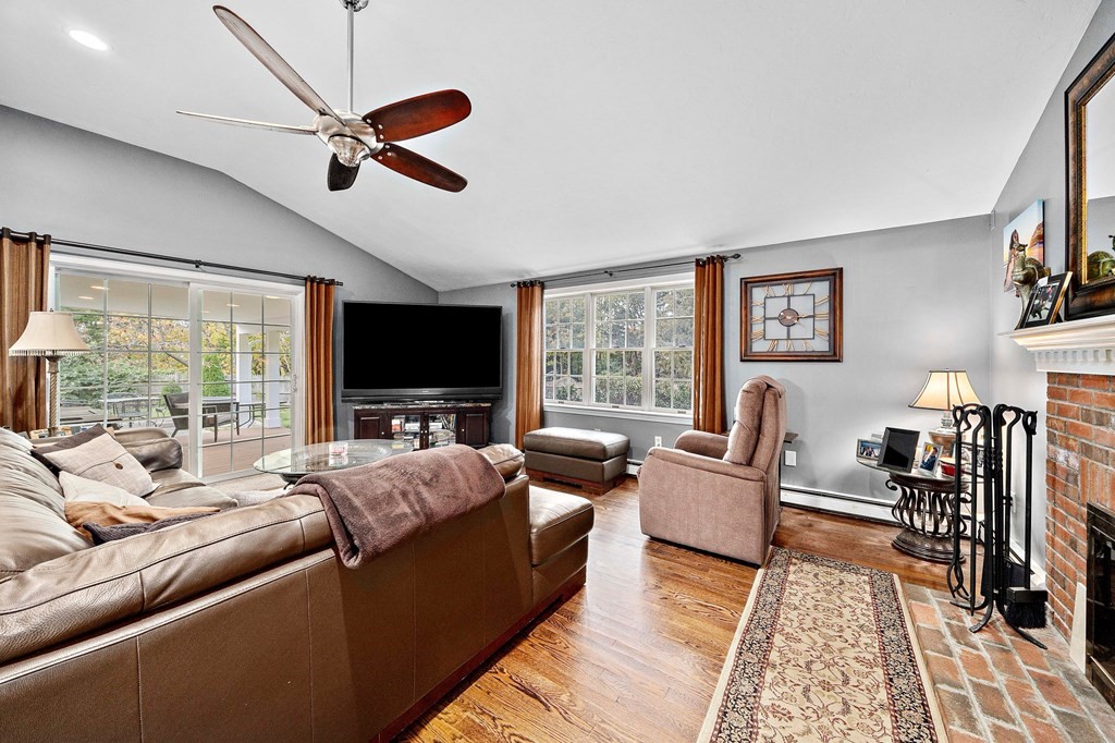20 Spring Valley Road Hull, MA 02045 - Photo 8 of 30 a living room with furniture fireplace and a flat screen tv