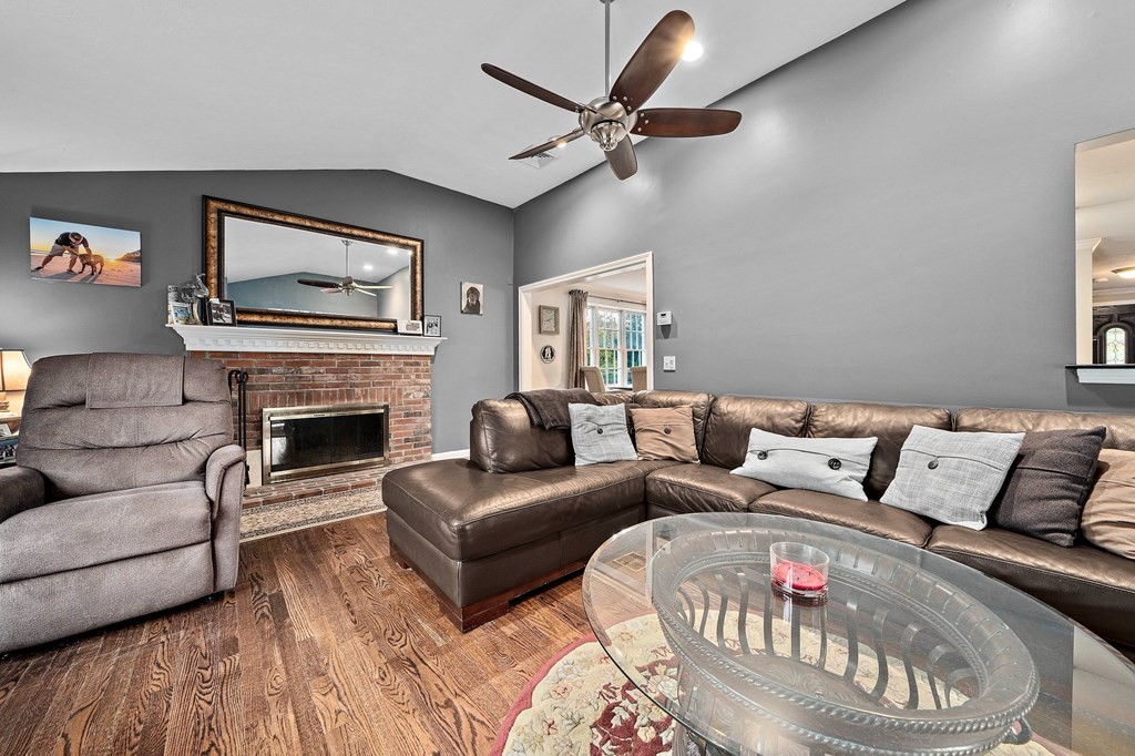 20 Spring Valley Road Hull, MA 02045 - Photo 10 of 30 a living room with furniture a fireplace and a flat screen tv