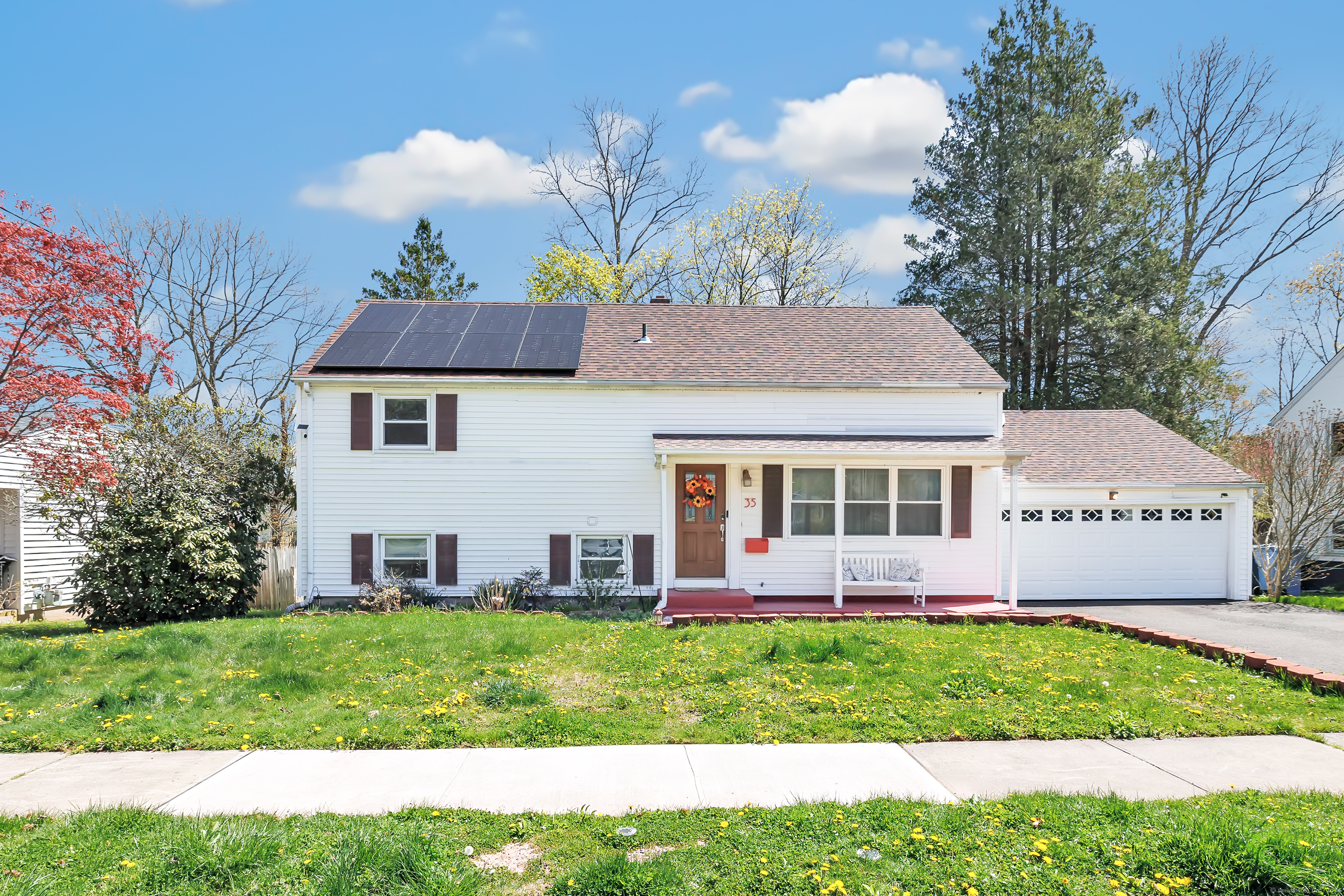 35 Pembroke Road Hamden, CT 06514 - Photo 1 of 1 a aerial view of a house with a yard and potted plants