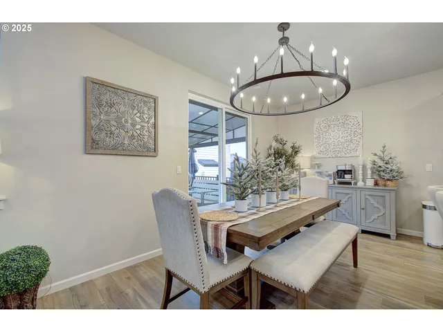 a dining room with furniture and wooden floor