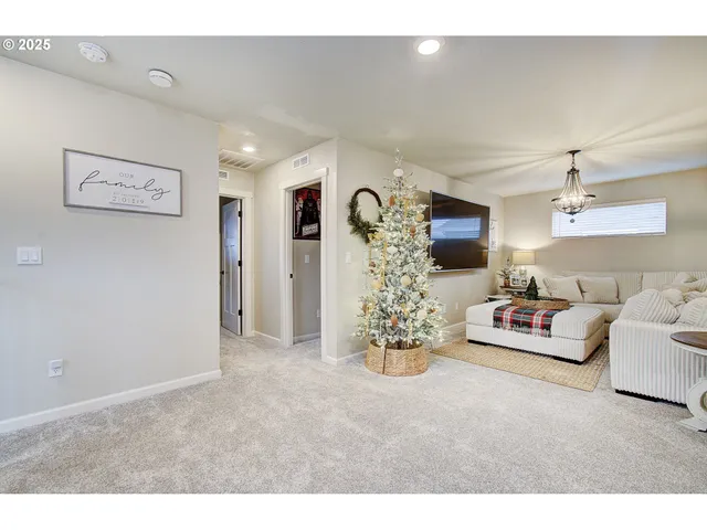 a living room with furniture and a table
