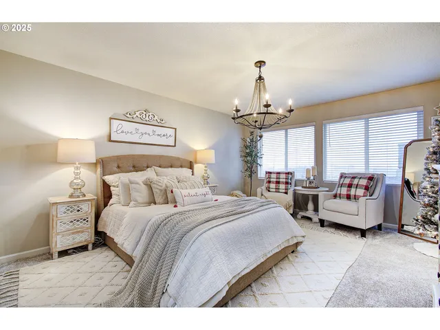 a bedroom with a bed couch and a window