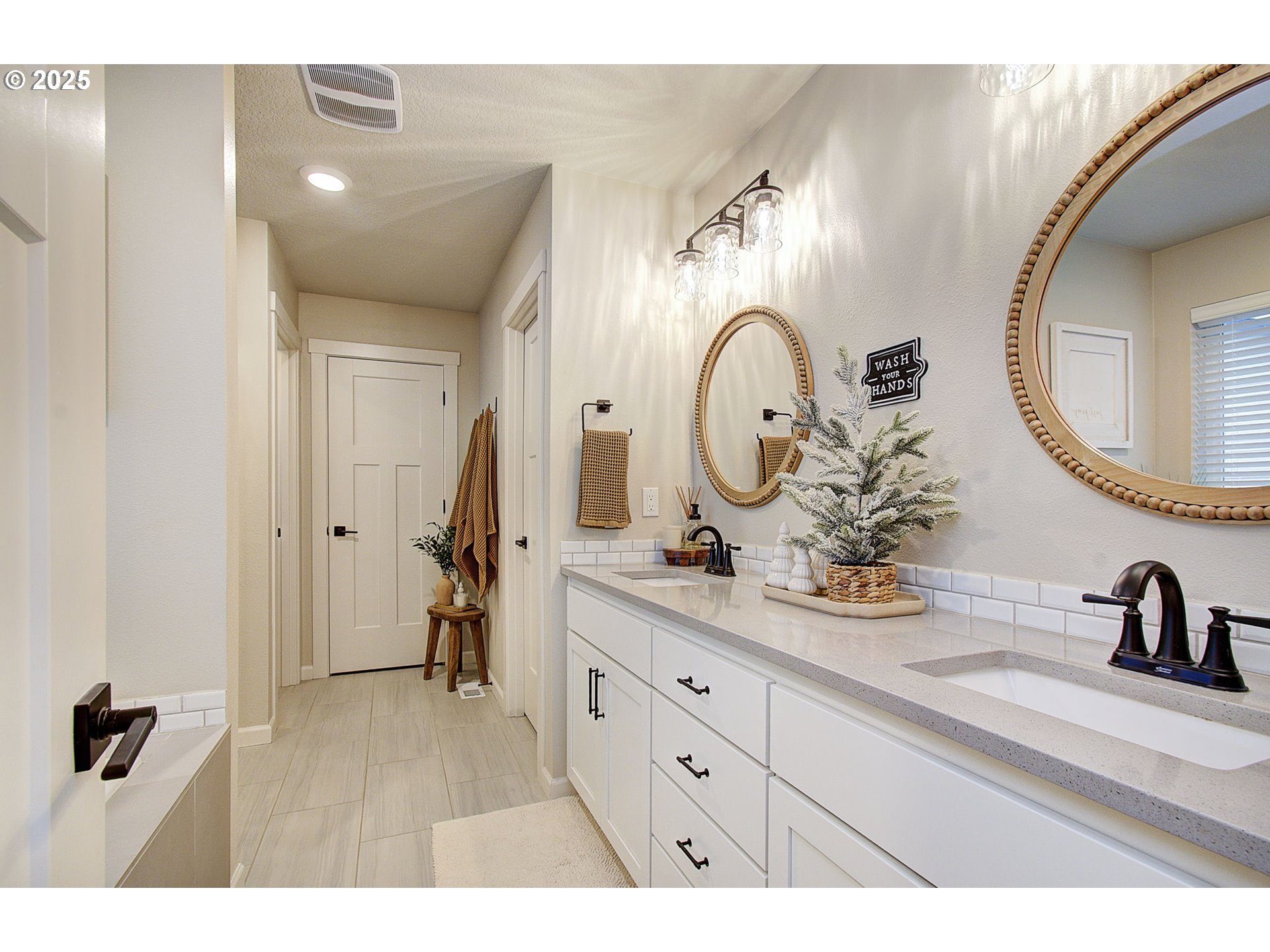 3947 Southwest Brixton Avenue Gresham, OR 97080 - Photo 21 of 41 a bathroom with a double vanity sink and a mirror