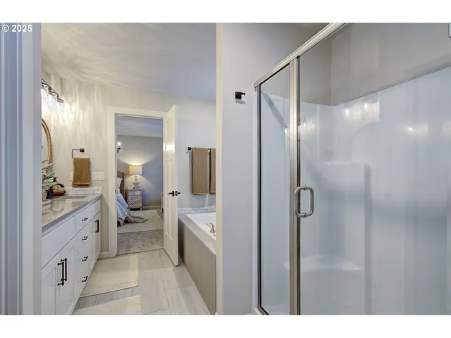 a bathroom with a double vanity sink a toilet and a mirror